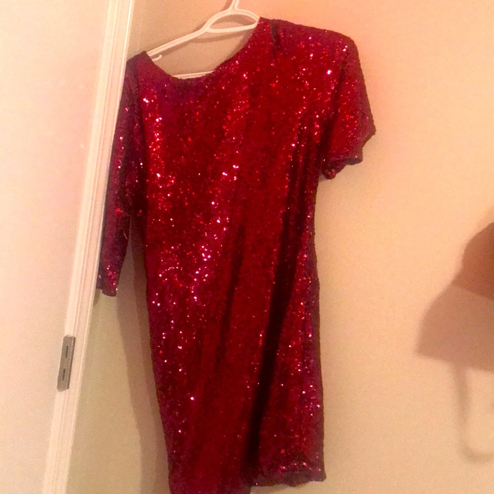 Nice dress with red glitter on it looking good and the size is 14